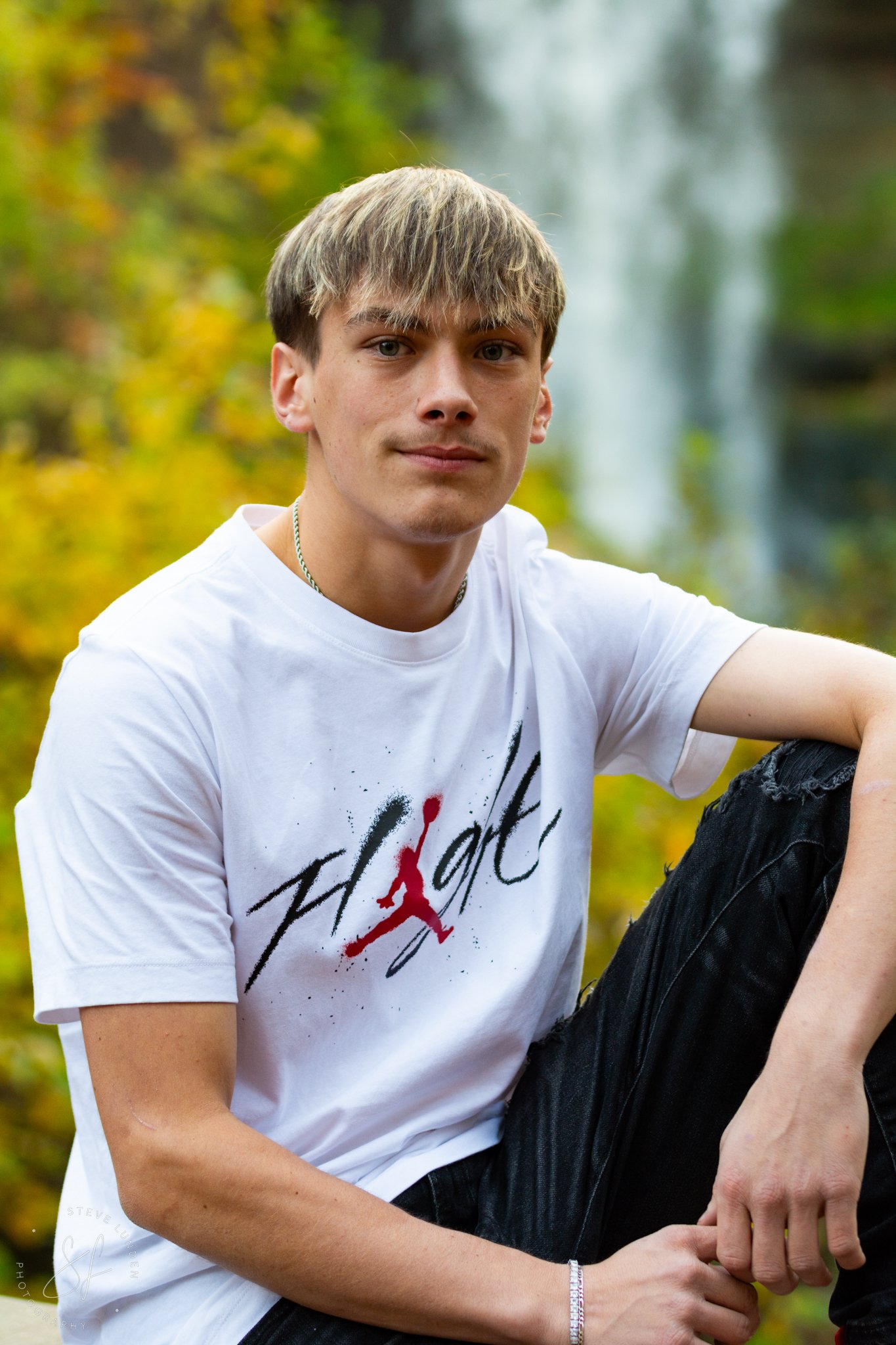 Minnehaha Falls Minneapolis senior photos with cascading waterfall and editorial styling